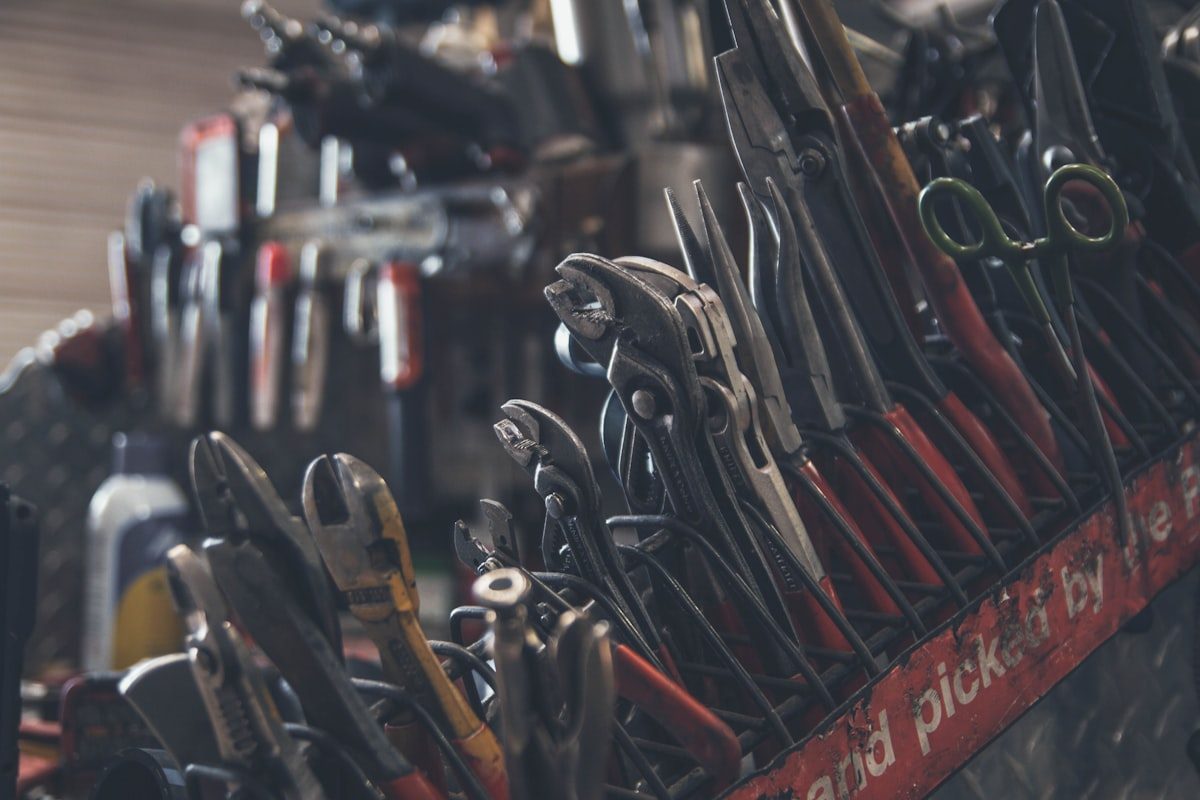 Hand tools laid out in a workshop toolbox